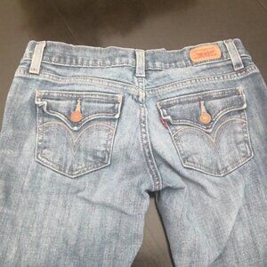 Levis Too Superlow 524 flap button back pockets